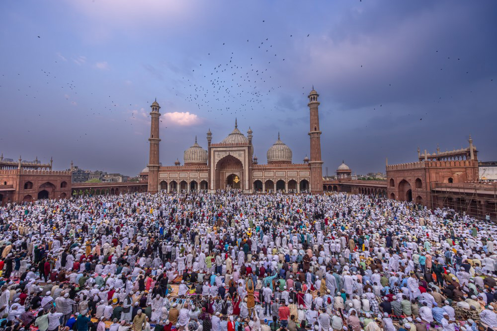 Devout Muslims celebrating Eid al-Fitr in Delhi, India.