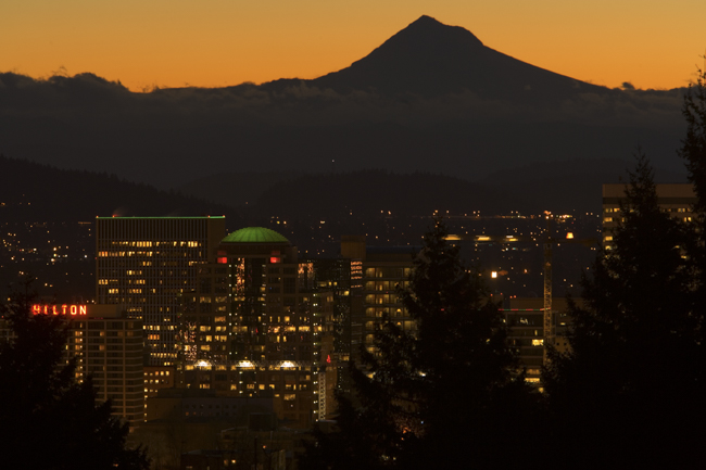 Mt. Hood is silhouetted against the golden sky of pre-dawn, Portland, Oregon